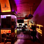 Entrance to the Dolby Atmos mixing room at Sonic Forest Studios with wood ceilings and studio sign