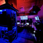 Focusrite RedNet R1 monitor controller displaying 7.1.4 Dolby Atmos output metering at Sonic Forest Studios
