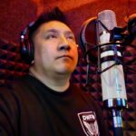 DJ Boitano at the microphone recording ADR in the vocal booth at Sonic Forest Studios