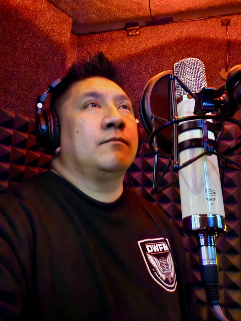 DJ Boitano at the microphone recording ADR in the vocal booth at Sonic Forest Studios
